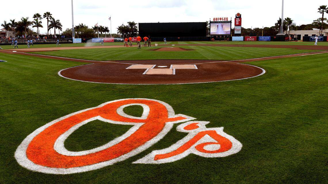 View of the Baltimore Orioles logo on the field before the start of the spring training game against the Tampa Bay Rays at Ed Smith Stadium.