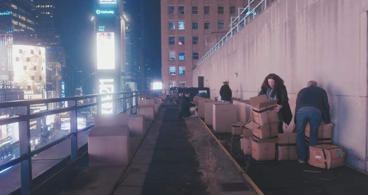 Volunteers get boxes of confetti in place for a recent New Year’s Eve ball drop celebration.
