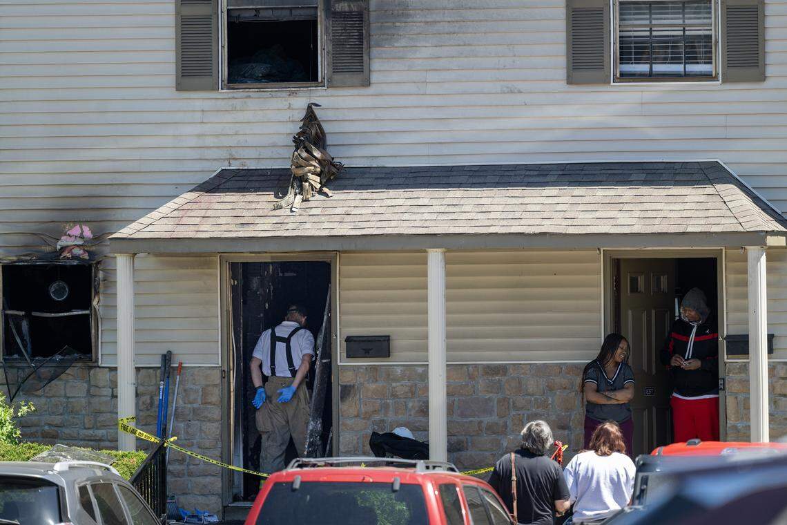 Overland Park firefighters investigate an early-morning apartment fire at Sheridan Ridge Apartments in the 8300 block of Farley Street on Saturday, April 18, 2026. Five people, two adults and three children, were taken to the hospital. One adult and three children were listed in critical condition, while the second adult was believed to have less serious injuries, according to the Overland Park Fire Department.