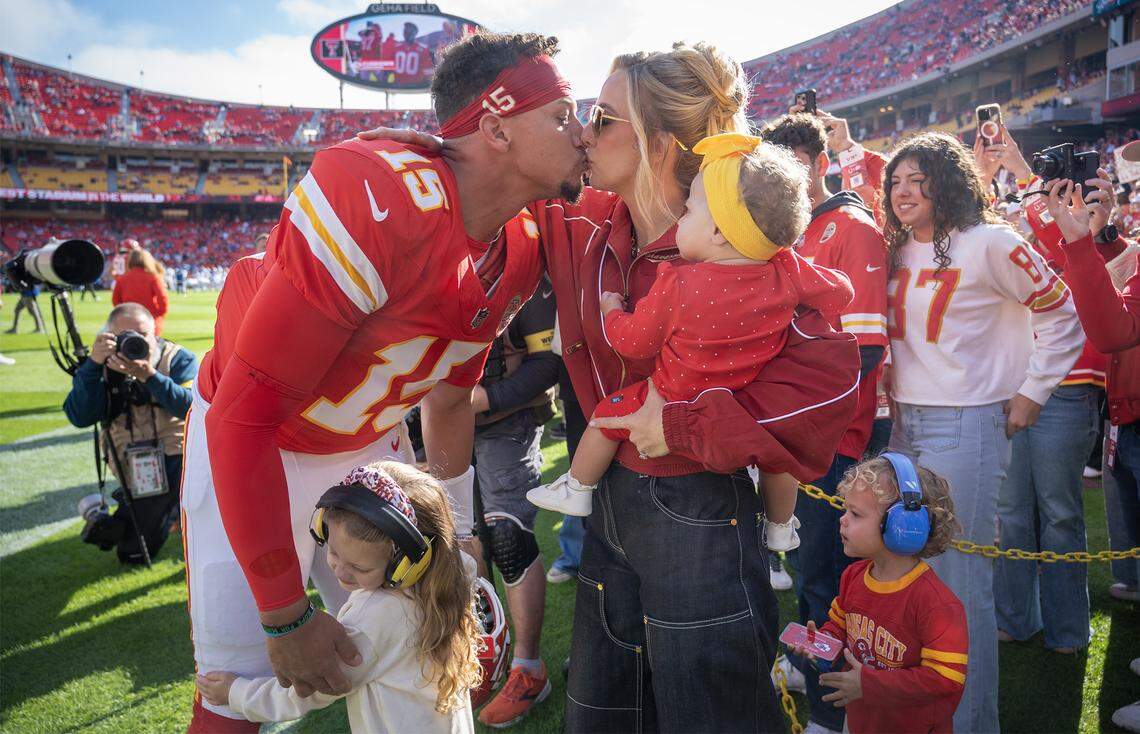 Chiefs quarterback Patrick Mahomes kisses wife Brittany Mahomes and greets his children before an NFL game against the Indianapolis Colts on Sunday, Nov. 23, 2025 at GEHA Field at Arrowhead Stadium in Kansas City.