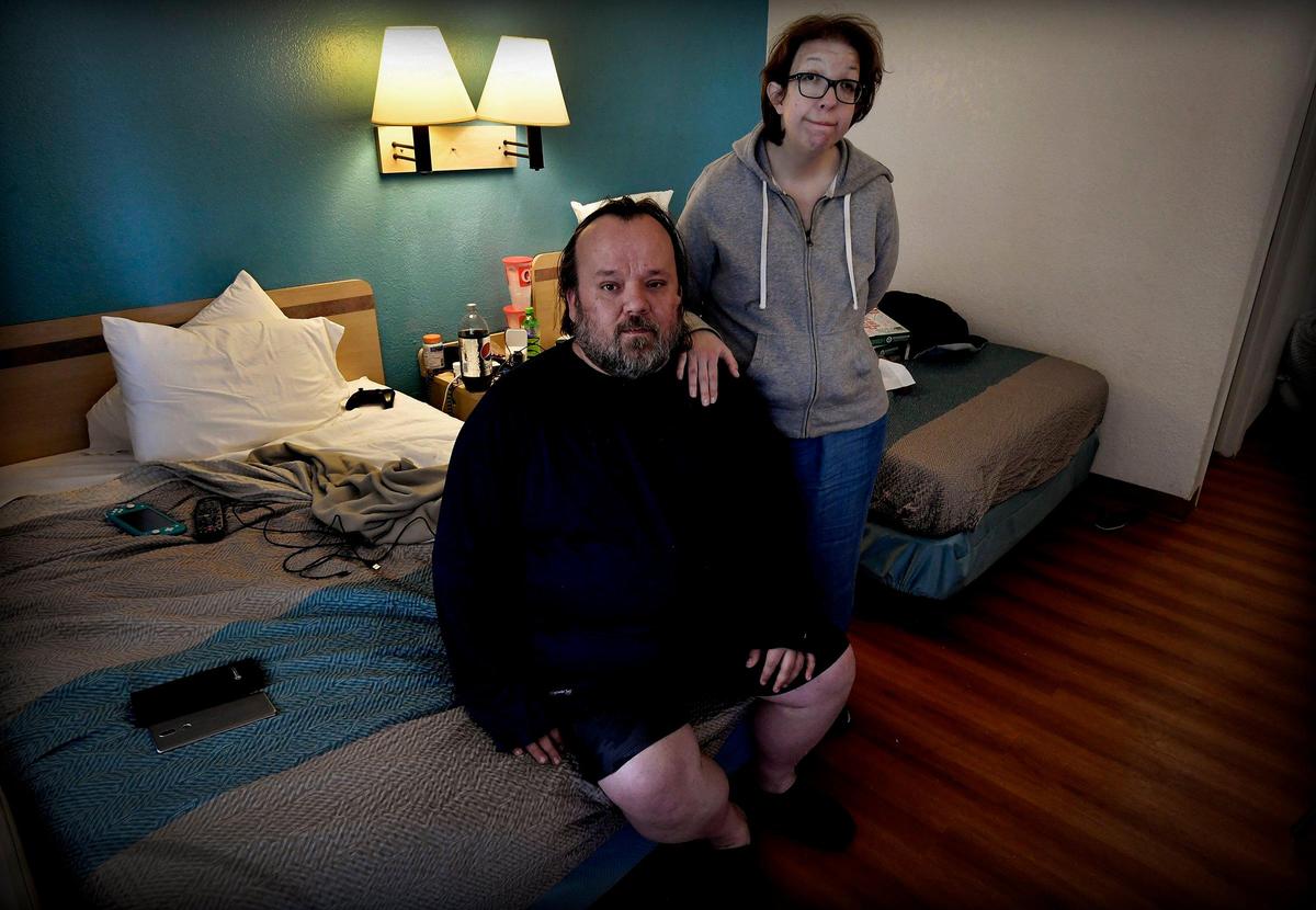 After Sarah Price was laid off from her job at a Northland department store, she and her husband, John, who was battling COVID-19, were left without any income. The couple were living in their van outside the store where she was working, but they said the police made them leave. With the help of a local agency, they were staying at a motel north of the river.