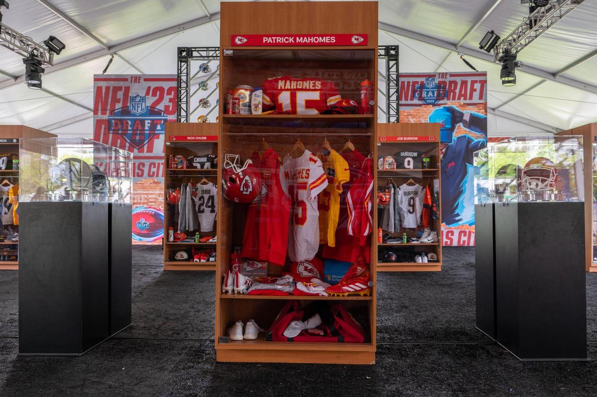Kansas City Chiefs quarterback Patrick Mahomes locker room equipment along with other players are displayed Wednesday at the NFL Draft Experience gallery.
