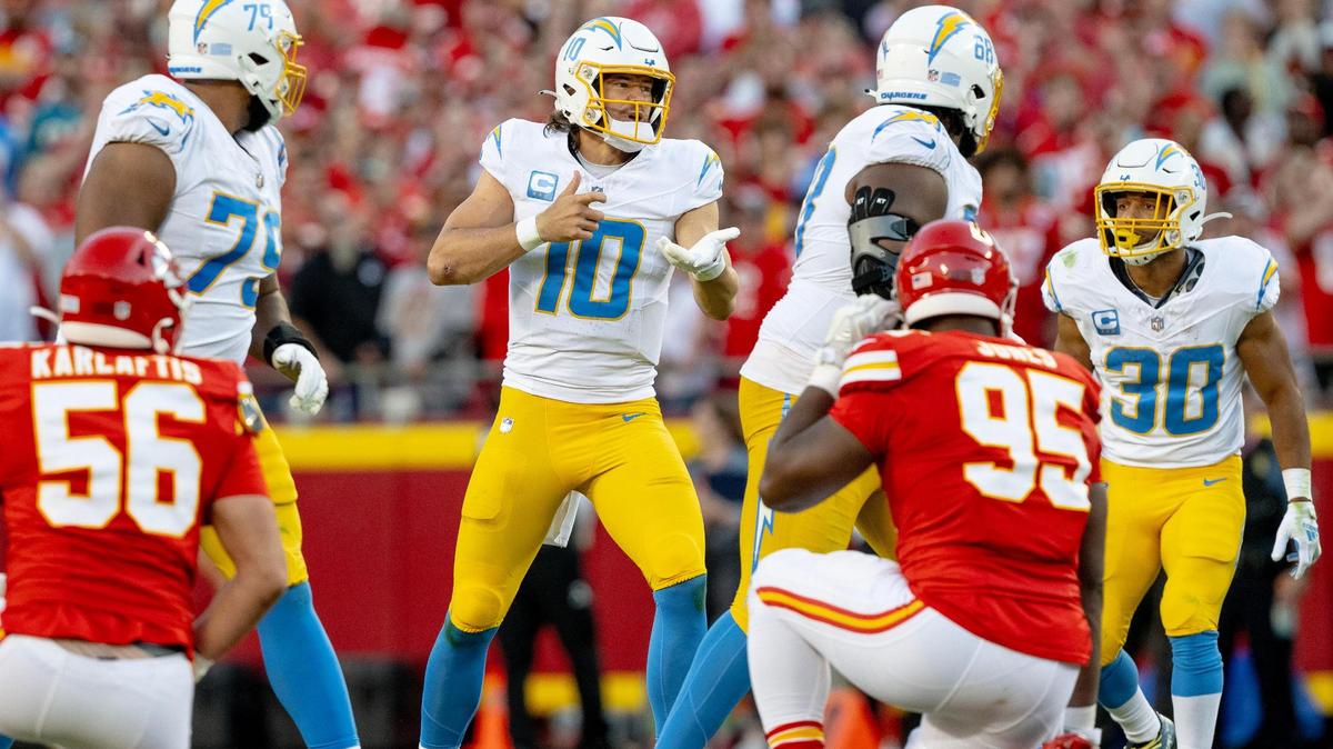 Los Angeles Chargers quarterback Justin Herbert (10) signals an audible to his teammates during an NFL football game against the Kansas City Chiefs at GEHA Field at Arrowhead Stadium on Sunday, Oct. 22, 2023, in Kansas City.
