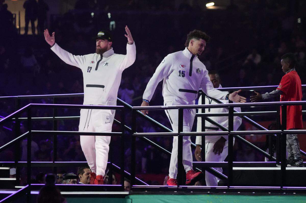 Kansas City Chiefs quarterback Patrick Mahomes (15) and tight end Travis Kelce (87) are introduced during Super Bowl LIX Opening Night at Ceasars Superdome on Feb. 3, 2025.