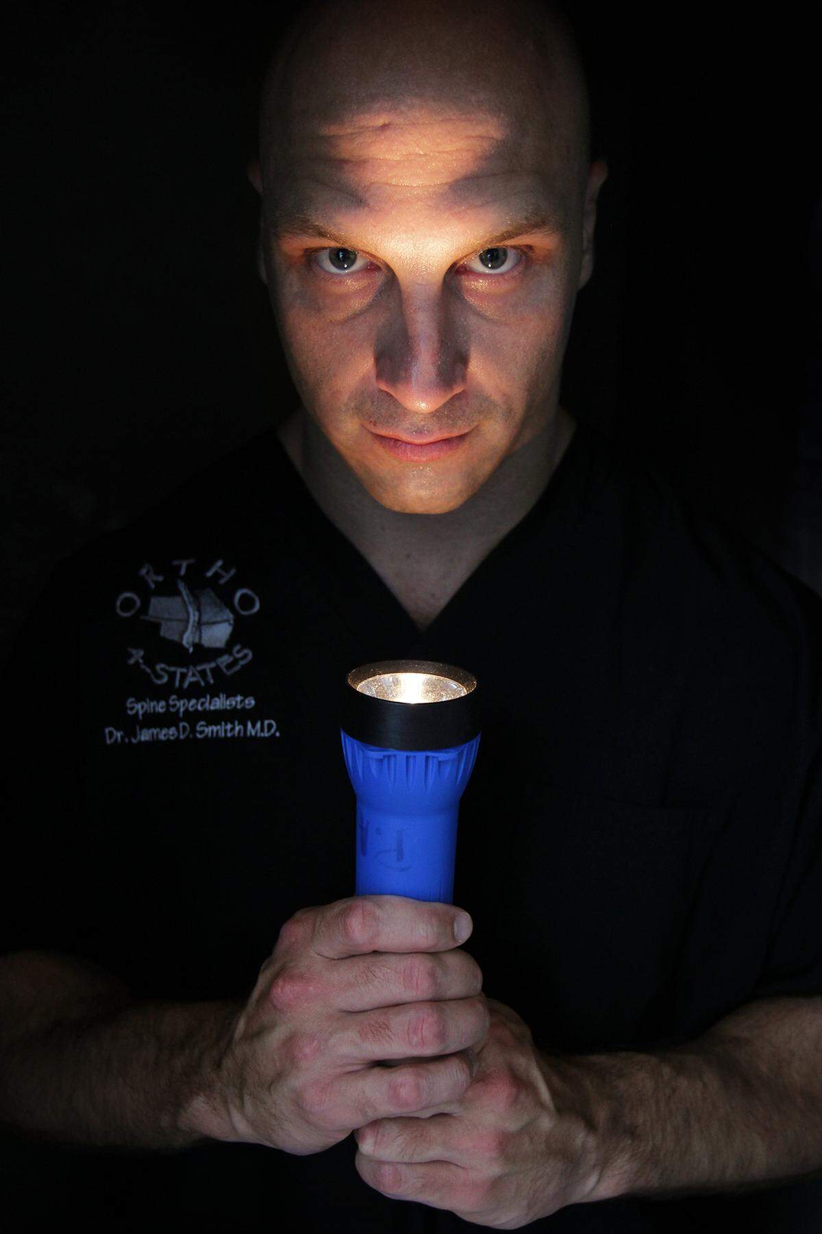 Orthopedic surgeon Dusty Smith used a blue flashlight to finish surgery as the tornado hit St. John's Medical Center.