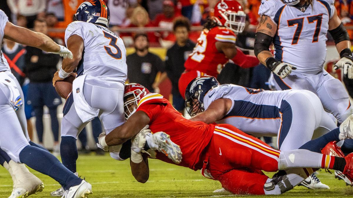 Kansas City Chiefs defensive tackle Chris Jones (95) sacks Denver Broncos quarterback Russell Wilson (3) in the second quarter during a game against the Denver Broncos at GEHA Field at Arrowhead Stadium on Thursday, Oct. 12, 2023, in Kansas City.