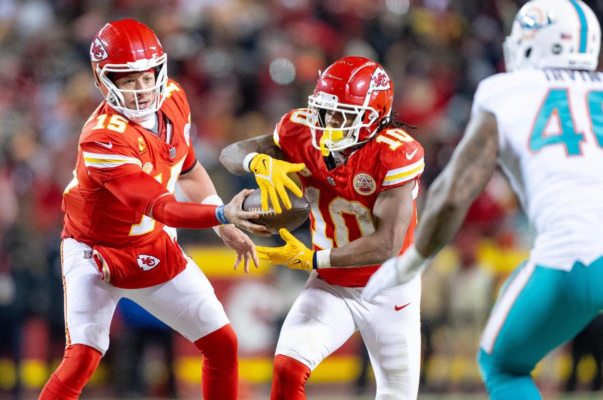 Kansas City Chiefs quarterback Patrick Mahomes (15) hands the ball off to running back Isiah Pacheco (10) against the Miami Dolphins during an AFC Wild Card game at GEHA Field at Arrowhead Stadium on Saturday, Jan. 13, 2024, in Kansas City.