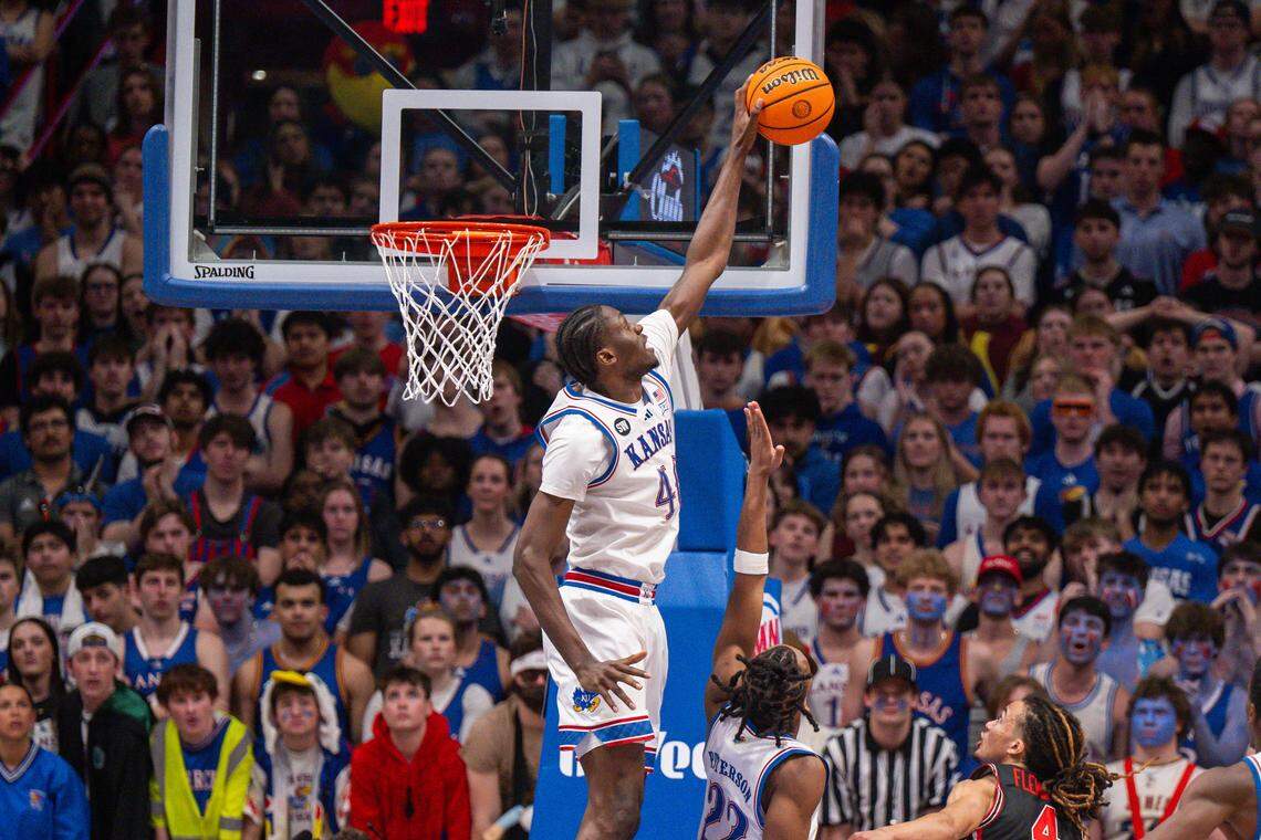Kansas Jayhawks forward Flory Bidunga (40) blocks a shot from Houston Cougars guard Kingston Flemings (4) in the second half on Monday, February 23, 2026, at Allen Fieldhouse.