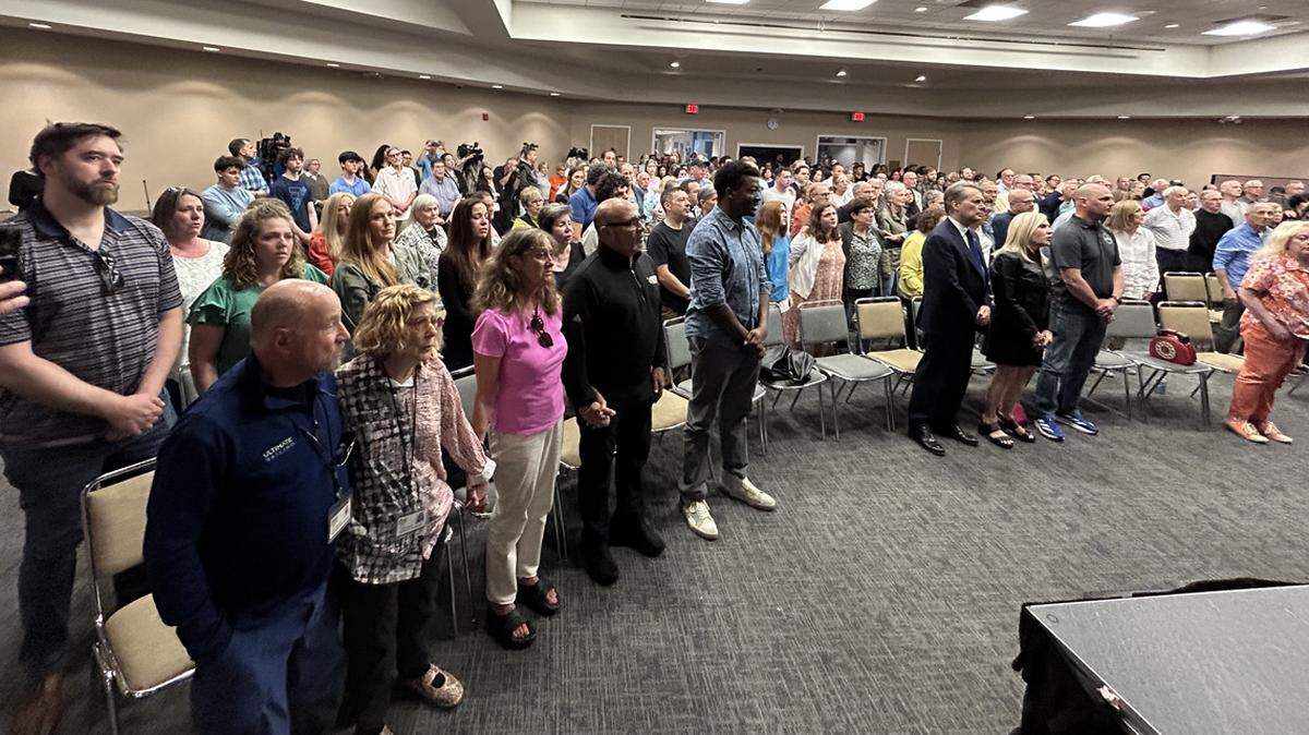 Mourners gathered at a vigil at the Jewish Community Center in Overland Park Thursday evening.