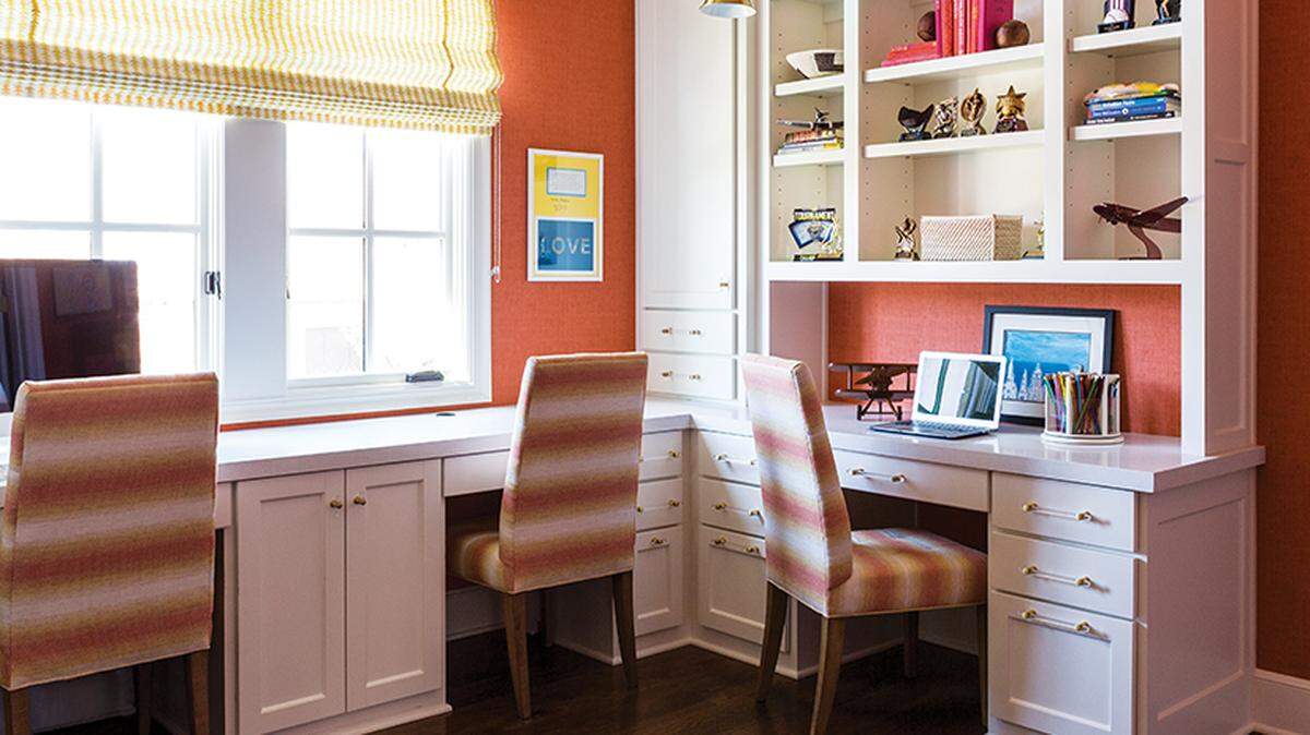 Noble Designs helped the owners of a former spec home in Overland Park add color and texture to every room, including the family office.