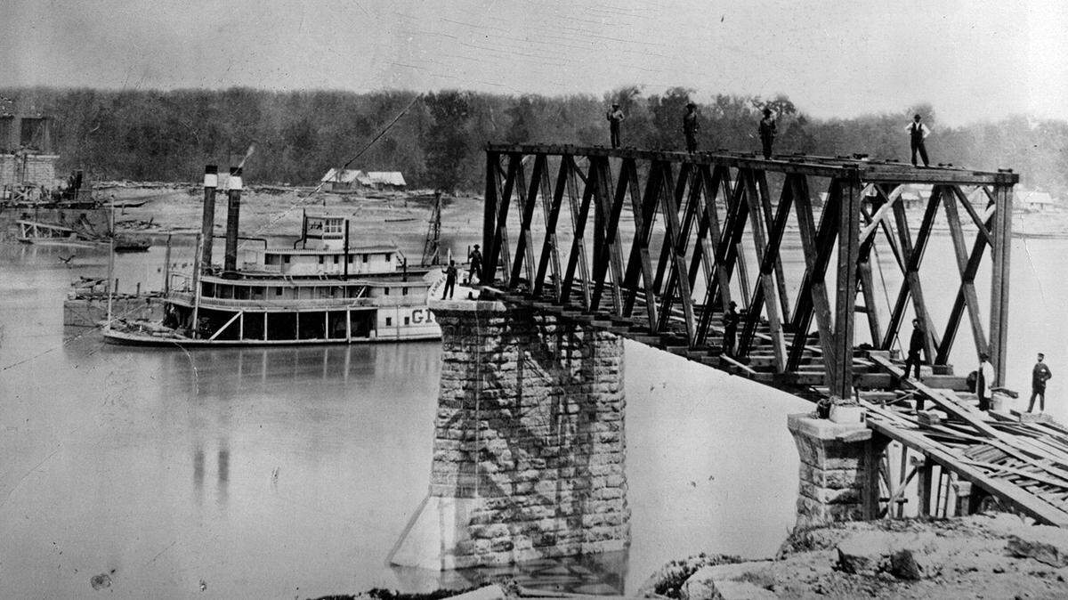 A steamboat travels past the Hannibal Bridge as it was being constructed in 1869 in Kansas City, Mo.