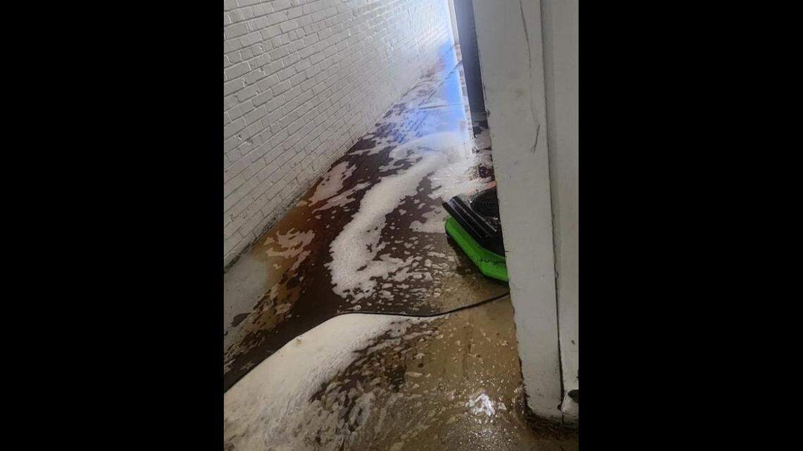 Flooding in a main hallway at Quality Hill Towers in downtown Kansas City led to water being turned off in the building.