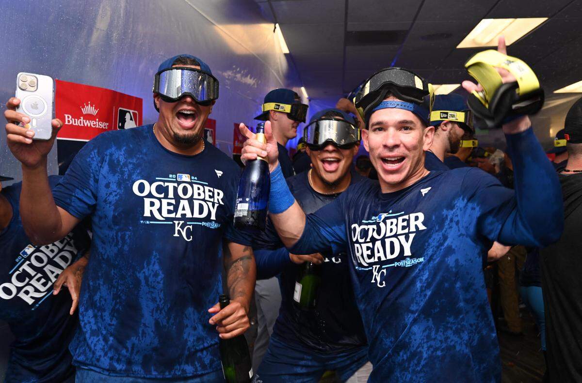 Kansas City Royals players celebrate in the locker room after defeating the Baltimore Orioles in Game 2 of the Wild Card round at Oriole Park at Camden Yards on Oct. 2, 2024.