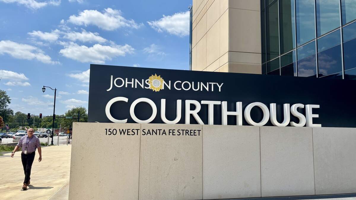 A pedestrian walks by the Johnson County District Courthouse in Olathe in this file photo from 2025.