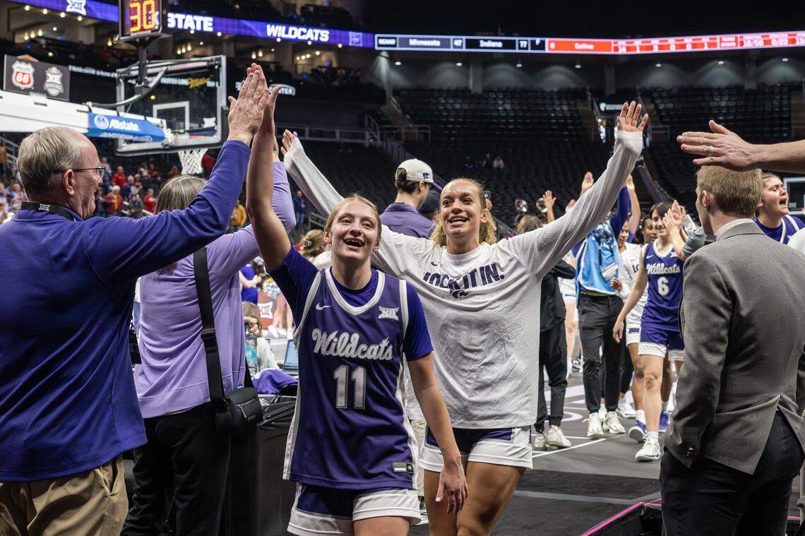 Kansas State Wildcats guards Taryn Sides (11) and Mikayla Parks (10) high-five fans while walking off the court after defeating the Texas Tech Red Raiders 56-51 in the Big 12 Women's Basketball Tournament at T-Mobile Center on Thursday, March 5, 2026, in Kansas City.