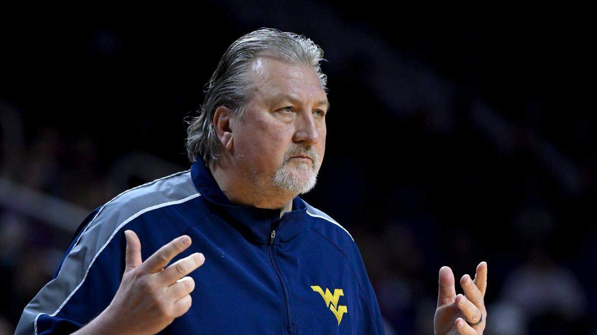 West Virginia head coach Bob Huggins signals to his team against Kansas State during the first half of an NCAA college basketball game in Manhattan, Kan., Monday, Feb. 14, 2022.