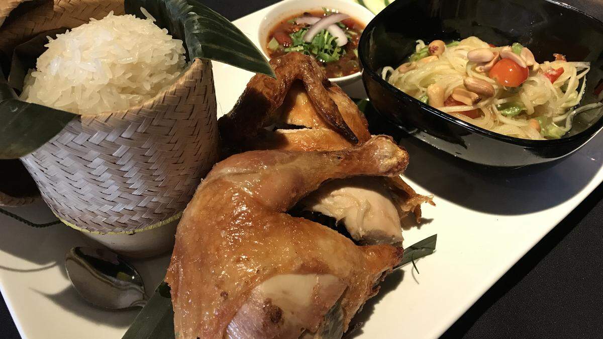 Waldo Thai Place’s Gai Tod Sum Tum - crispy fried chicken, papaya salad, sticky rice and “Jaew” spicy sauce.