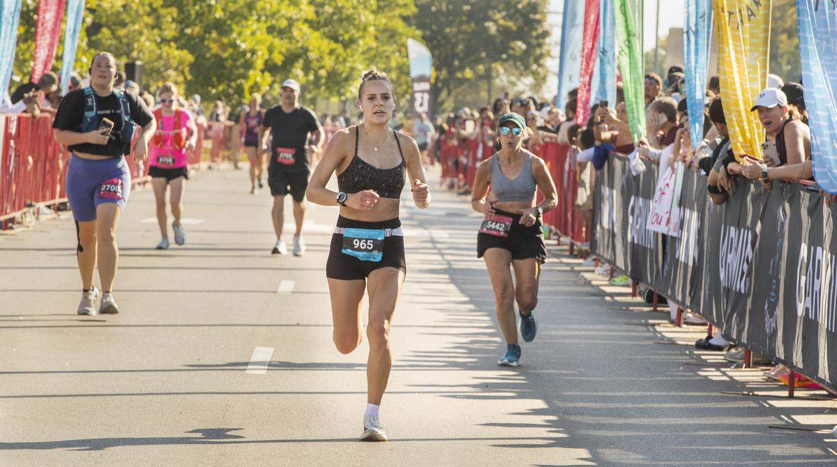Garmin Kansas City Marathon overall women’s winner Kenadi Krueger runs toward the finish line on Saturday, Oct. 18, 2025, in Kansas City.