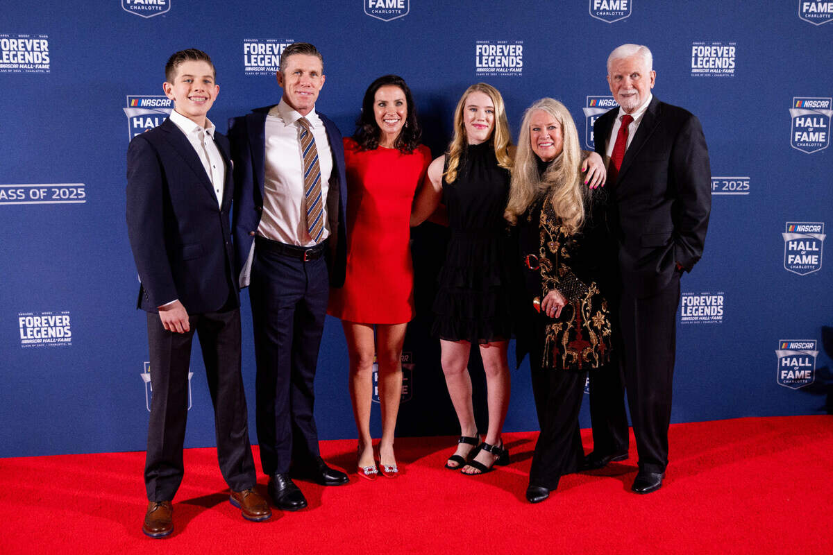 Former NASCAR driver Carl Edwards, second from left, poses with his family on the red carpet before the 2025 NASCAR Hall of Fame Induction Ceremony at the Charlotte Convention Center’s Crown Ballroom on Friday, Feb. 7 in Charlotte, North Carolina.