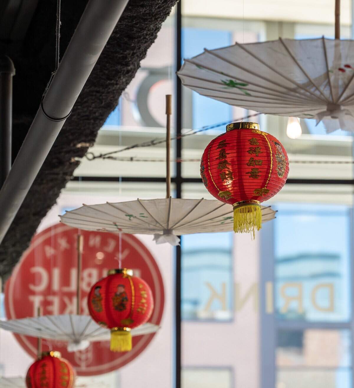 Chinese lanterns are displayed along a railing during a Lunar New Year celebration at the Lenexa Public Market on Sunday, Feb. 22, 2026, in Lenexa.