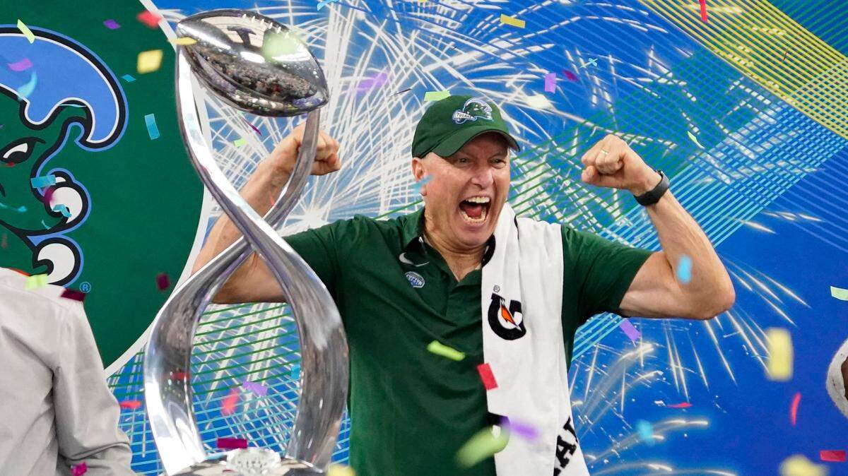 Tulane head coach Willie Fritz celebrates with the trophy after the Cotton Bowl NCAA college football game against Southern California, Monday, Jan. 2, 2023, in Arlington, Texas.