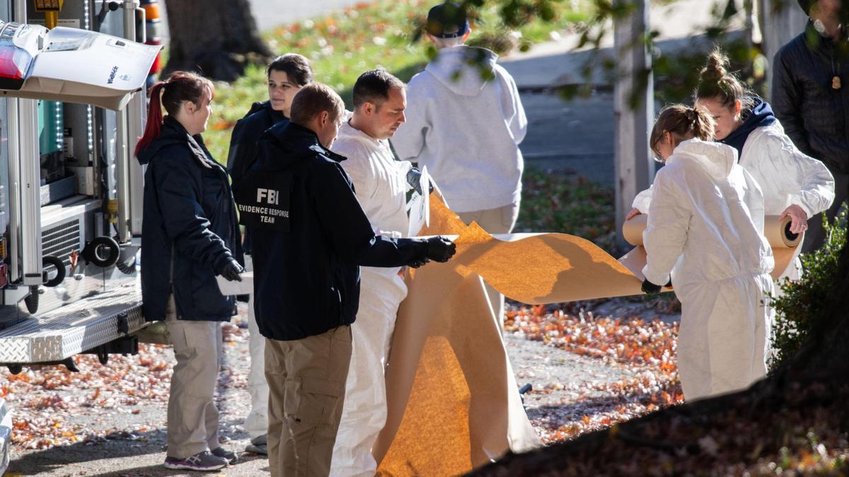 An FBI emergency response team prepare to enter a house in Kansas City where a FBI agent-involved shooting took place on Monday, Nov. 25, 2024.