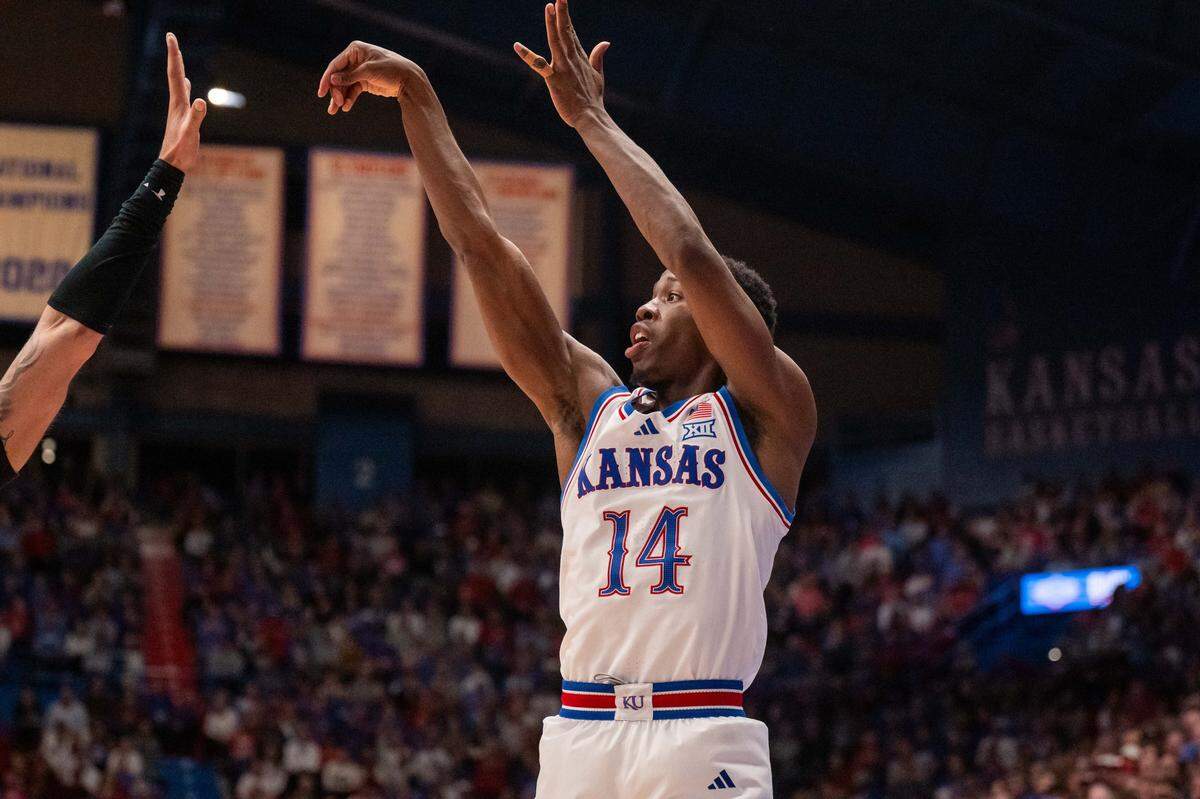 Kansas Jayhawks guard Melvin Council Jr. (14) shoots a 3-pointer in the first half vs. the Towson Tigers on Tuesday, December 16, 2025, at Allen Fieldhouse.