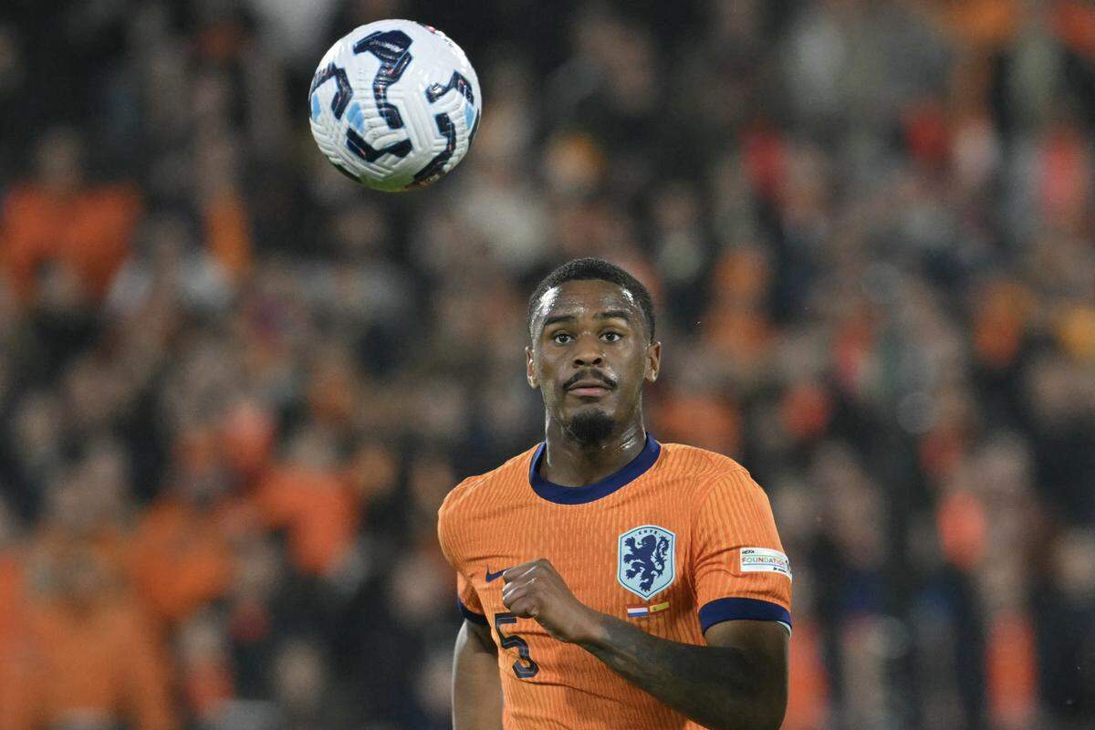 Netherlands defender #05 Jorrel Hato eyes the ball during the UEFA Nations League quarterfinal first leg match between Netherlands and Spain at De Kuip stadium in Rotterdam, on March 20, 2025.