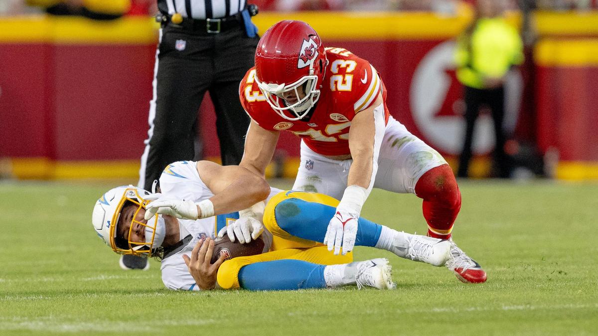 Chiefs linebacker Drue Tranquill (No. 23) sacks Los Angeles Chargers quarterback Justin Herbert during an Oct. 22 game at GEHA Field at Arrowhead Stadium.