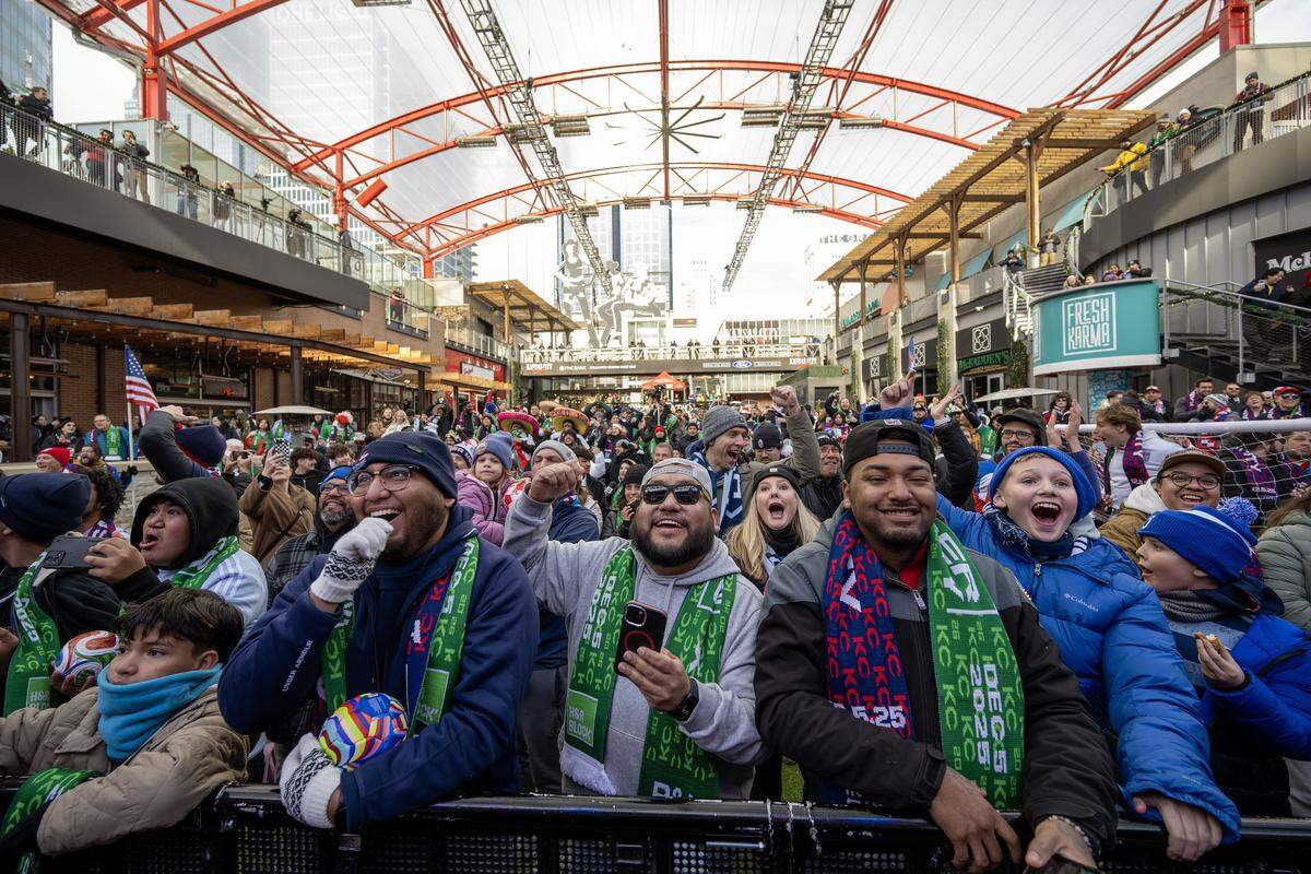 Fans cheer as the teams for Group J of the FIFA World Cup are announced during a watch party at the Power & Light District on Friday, Dec. 5, 2025, in Kansas City.