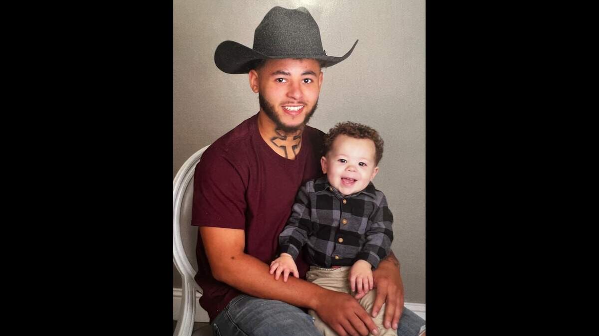 Thomas Lewis poses with his son. Lewis was killed early Monday, Jan. 30, in Kansas City while attending an illegal sideshow.