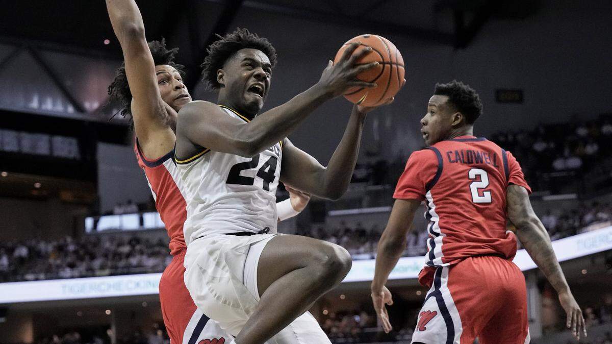 Missouri Tigers guard Kobe Brown shoots as Mississippi forward Jayveous McKinnis defends during the first half at Mizzou Arena on March 4, 2023.
