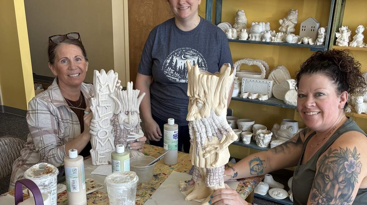 Cami Lacen, Potter’s Haven owner, watches Shannon Silver (left) and Jennifer Snyder work on their latest projects. Silver and Snyder are regular visitors to the Lee’s Summit studio.