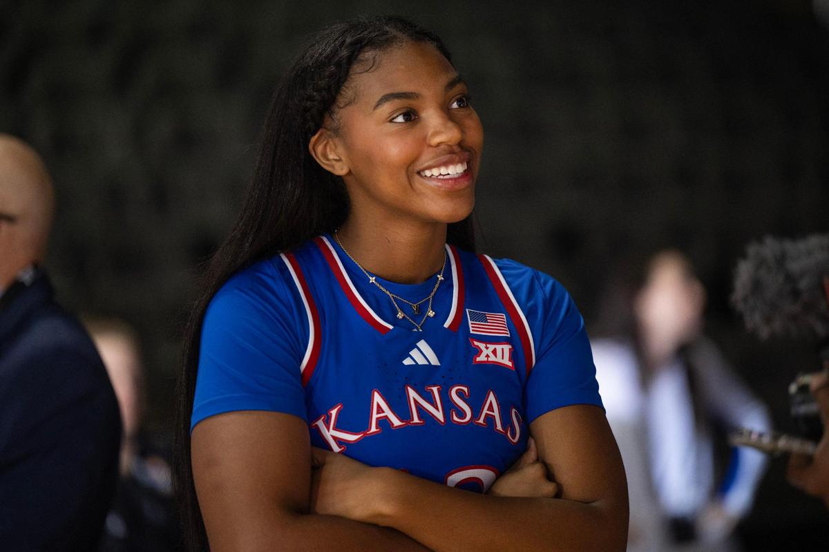 Kansas Jayhawks guard S’Mya Nichols (12) answers questions from media members during Big 12 Media Day at T-Mobile Center on Tuesday, Oct. 22, 2024, in Kansas City.