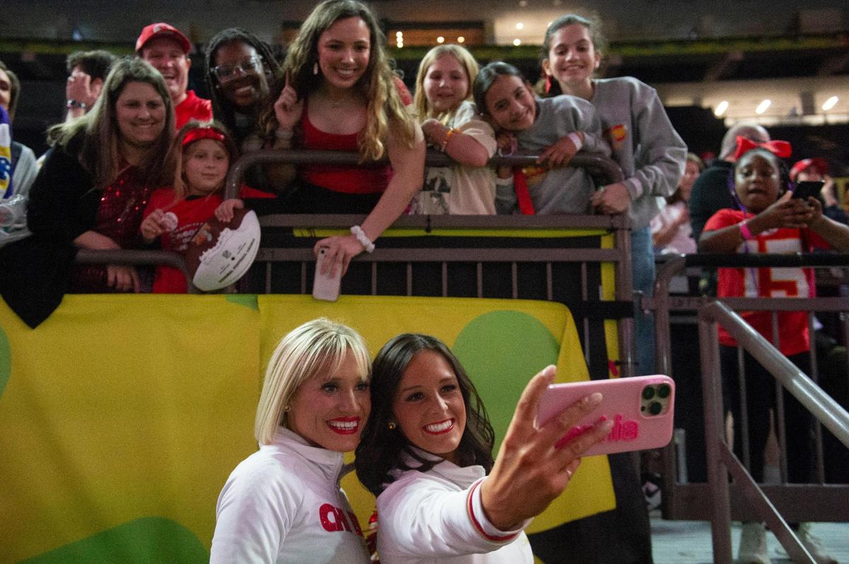 Kansas City Chiefs cheerleaders take photos with fans during opening night of the Super Bowl at Caesars Superdome in New Orleans on Monday, Feb. 3, 2025.