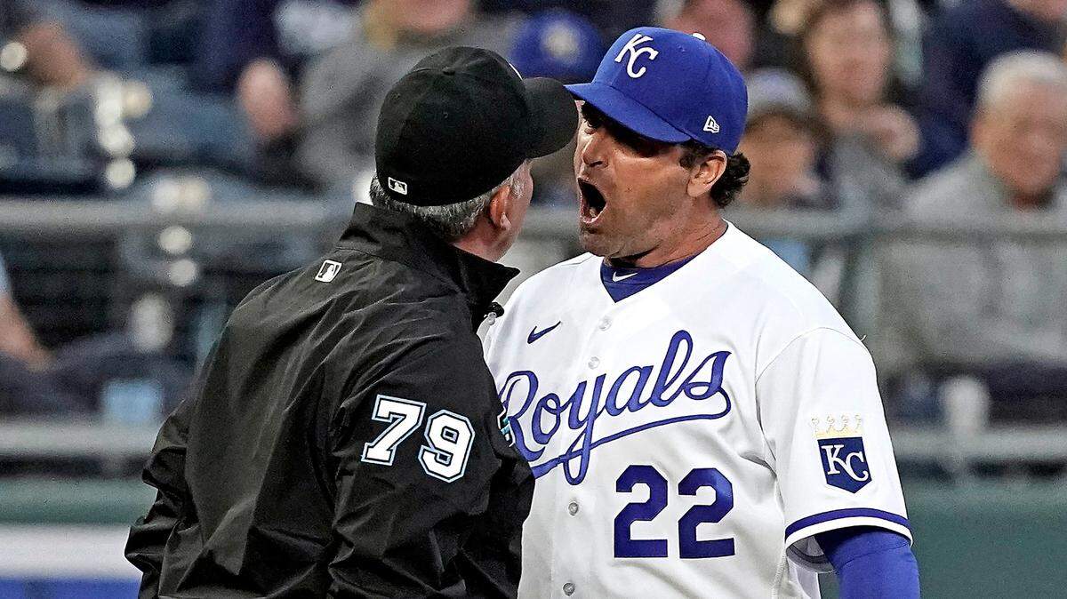 Kansas City Royals manager Mike Matheny (22) argues a call with third base umpire Manny Gonzalez during the second inning of a baseball game Friday, April 29, 2022, in Kansas City, Mo. (AP Photo/Charlie Riedel)
