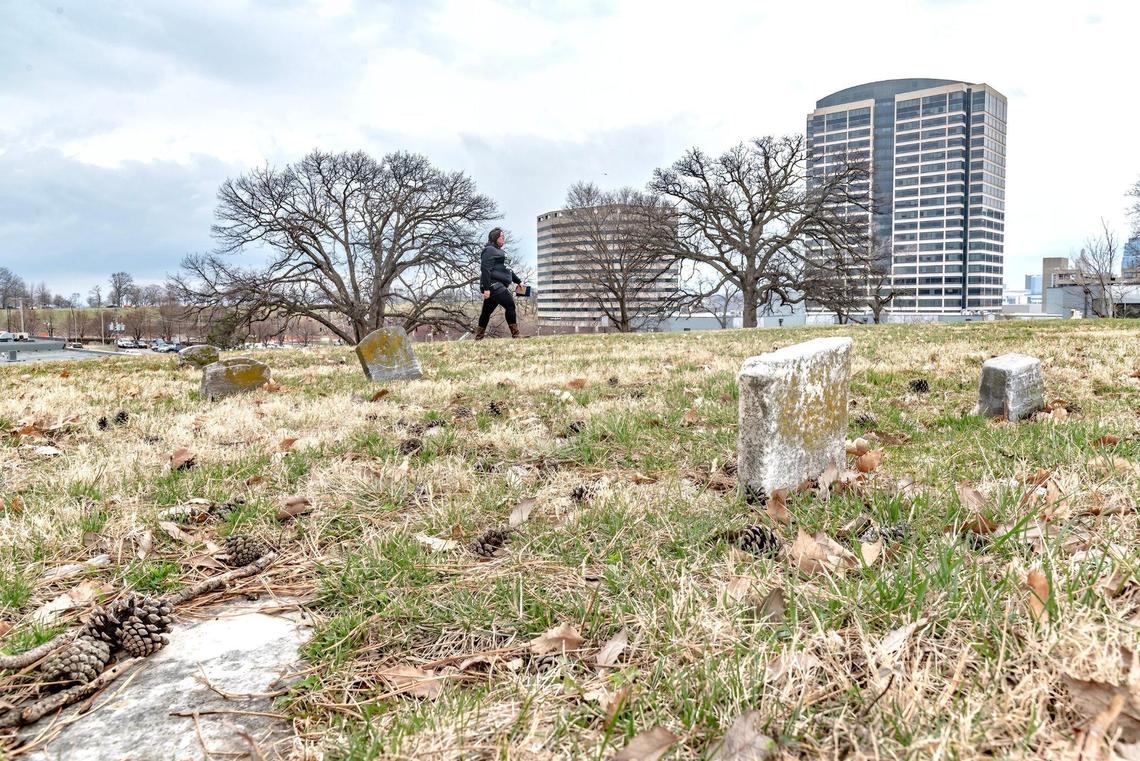 Heather Faries, vice president of the Union Cemetery Historical Society, walks through the cemetery’s potter’s field, where the bodies of the poor were once buried two-, three-, perhaps even 12-deep to a grave.