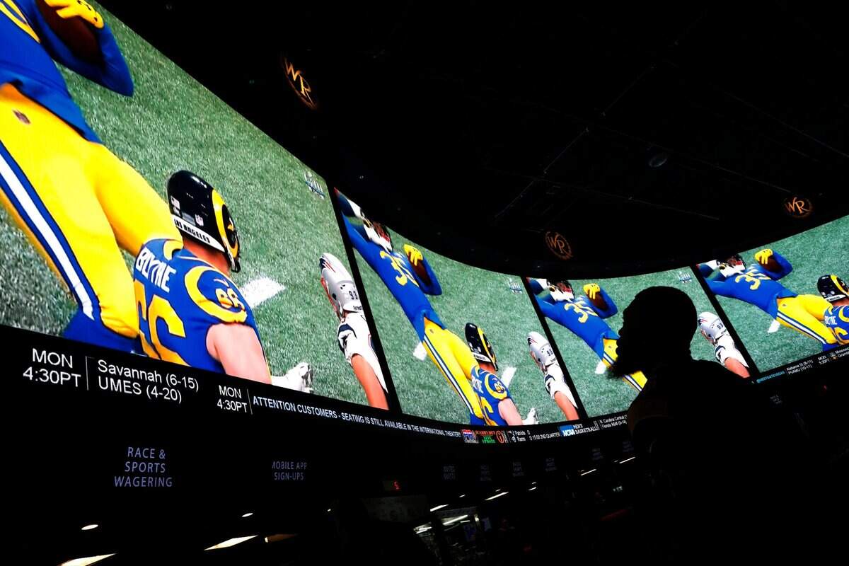 In this Feb. 3, 2019, file photo, a man watches Super Bowl LIII at the Westgate Superbook sports book in Las Vegas.