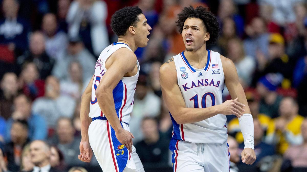 Kansas forward Jalen Wilson (10) celebrates with guard Kevin McCullar Jr. (15) after drawing a foul while scoring against Arkansas during a second-round college basketball game in the NCAA Tournament Saturday, March 18, 2023, in Des Moines, Iowa.