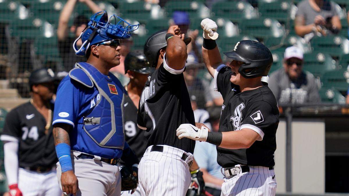 Kansas City Royals catcher Salvador Perez stands by the plate as Chicago White Sox’s Elvis Andrus, center, and Andrew Vaughn, right, celebrate a two-run home run by Vaughn that scored Andrus in the third inning of a baseball game in Chicago, Thursday, Sept. 1, 2022. (AP Photo/Nam Y. Huh)