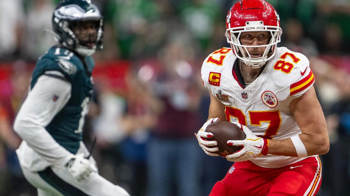 Kansas City Chiefs tight end Travis Kelce (87) runs with a pass as Philadelphia Eagles linebacker Josh Sweat (19) goes after him in the second half of Super Bowl LIX on Sunday, Feb. 9, 2025, in New Orleans.