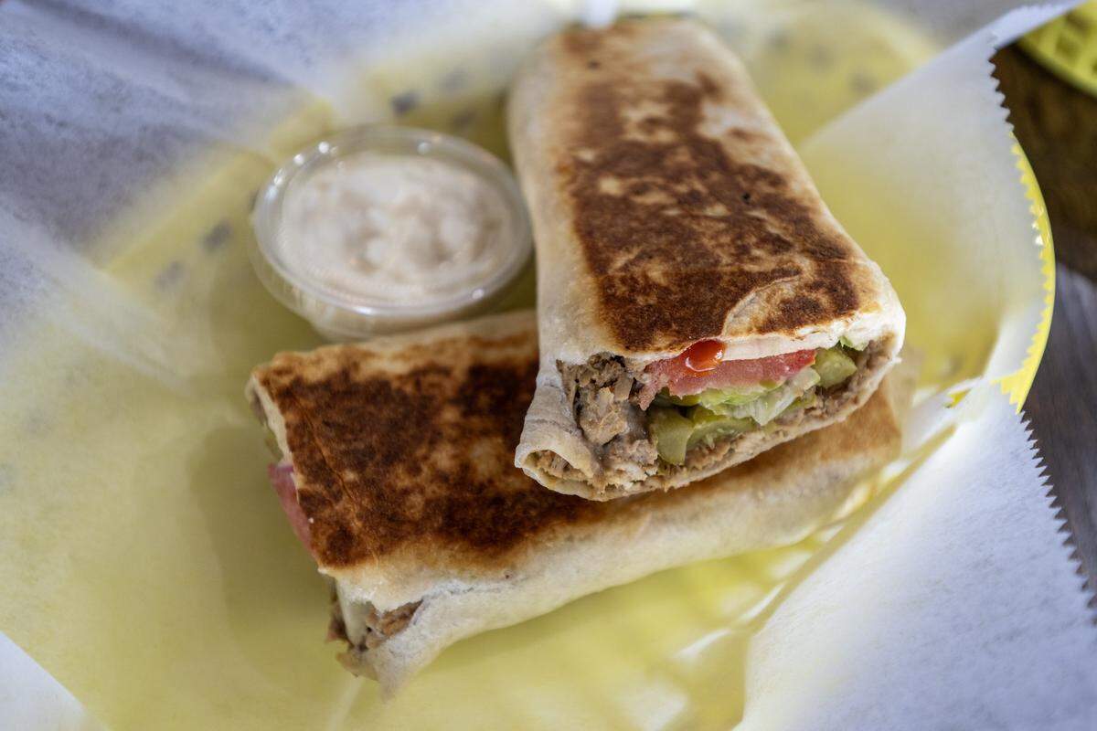Chicken shawarma paired with a house-made sauce is served at Hummus and Pita on Tuesday, Sept. 2, 2025, in Overland Park.
