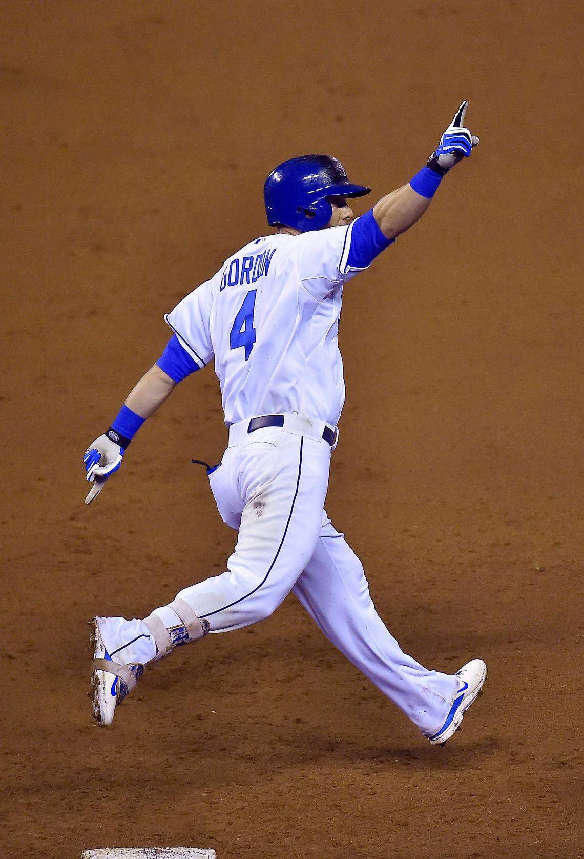Kansas City Royals left fielder Alex Gordon rounds first on his way to home plate after hitting a solo home run in the ninth inning to tie the game 4-4 during Game 1 of the World Series on Tuesday, October 27, 2015 at Kauffman Stadium in Kansas City, Mo.