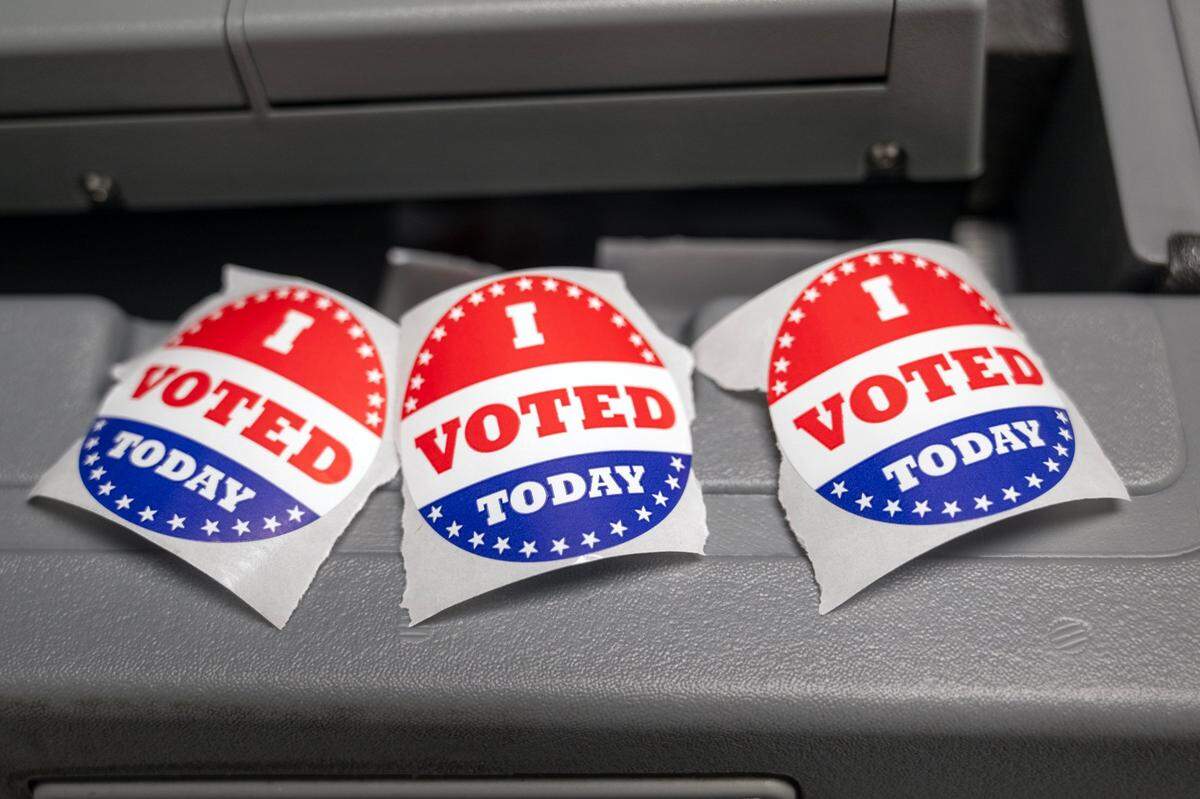 “I voted today” stickers awaited voters who cast their no-excuse absentee ballots at the Palestine Senior center on Oct. 22, 2024, in Kansas City.