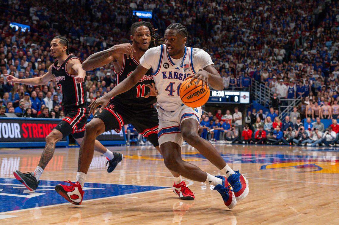 Kansas Jayhawks forward Flory Bidunga (40) backs down Houston Cougars forward Joseph Tugler (11) during the first half on Monday, February 23, 2026, at Allen Fieldhouse.