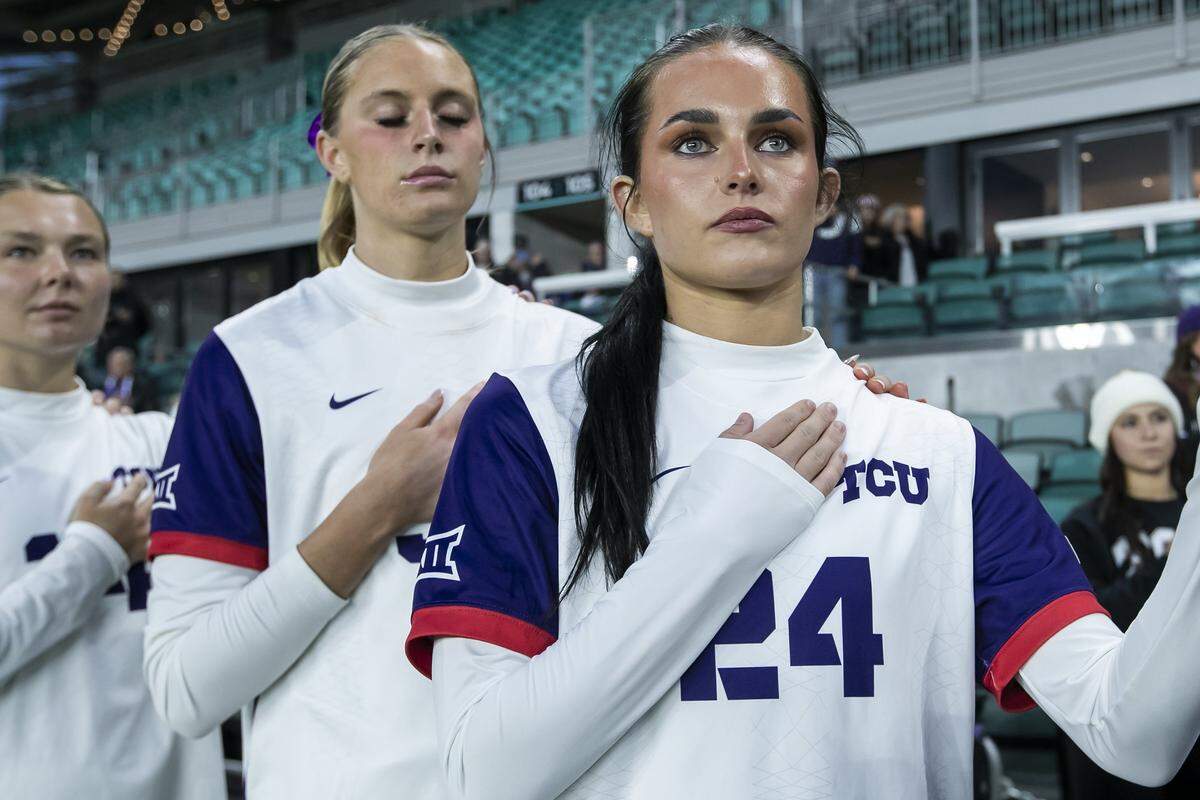 TCU forward Sadie Paul (24) and her teammates stand for the national anthem before a College Cup national semifinal Friday at CPKC Stadium in Kansas City, Mo.