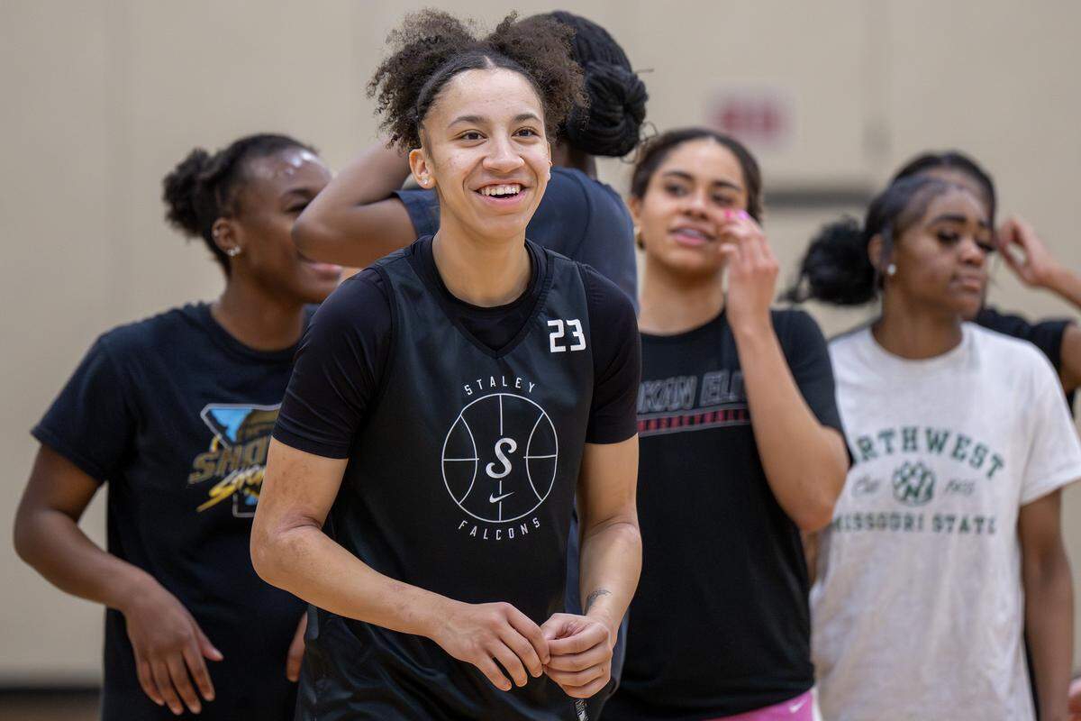 Ava Miles smiles while warming up during basketball practice at Staley High School on Thursday, Jan. 22, 2026, in Kansas City.
