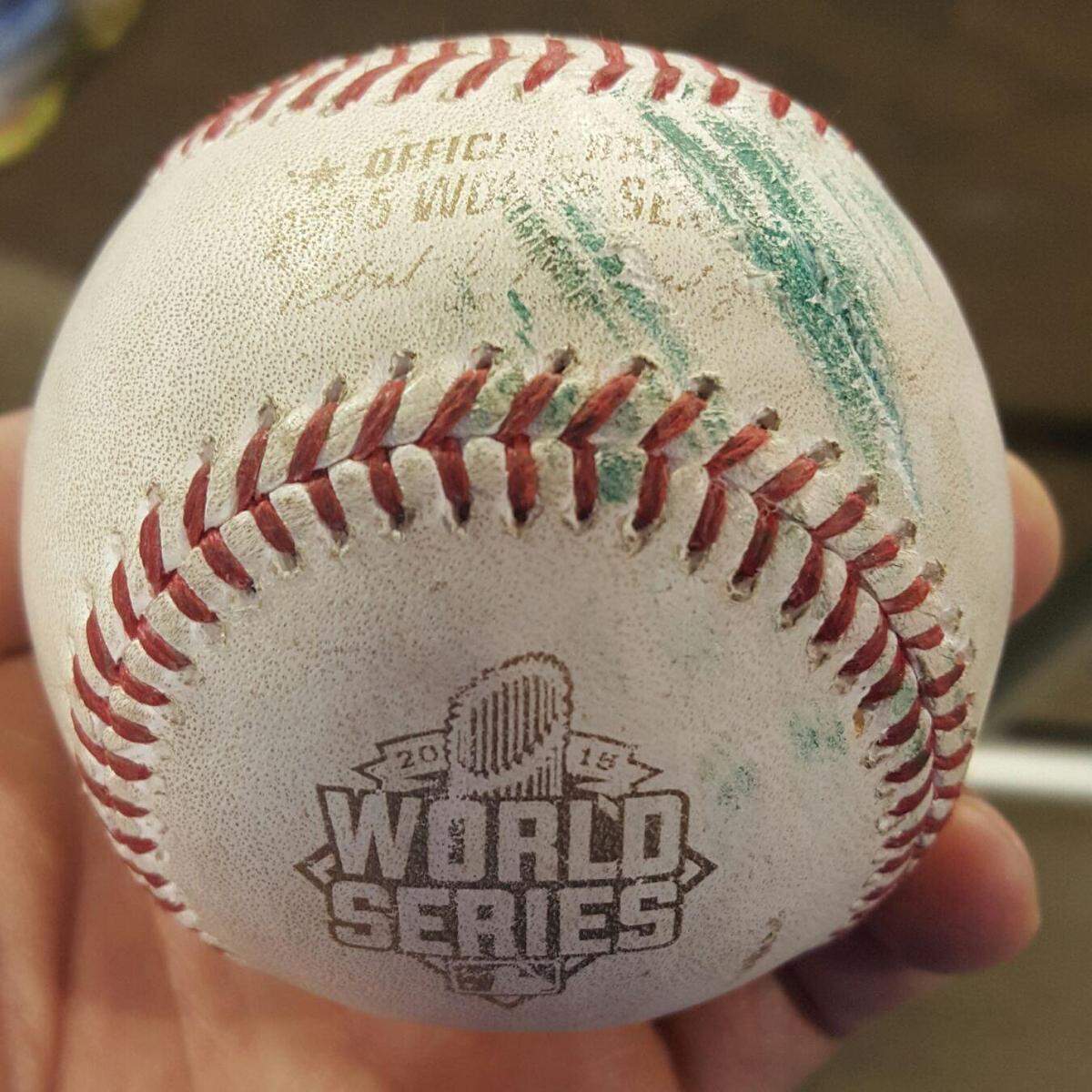 The ball has a shade of green from the batter’s eye.