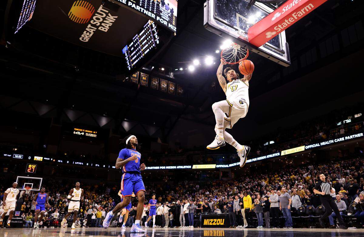 Jayden Stone #17 of the Missouri Tigers dunks on a fast break during the game against the Florida Gators at Mizzou Arena on January 3, 2026 in Columbia.