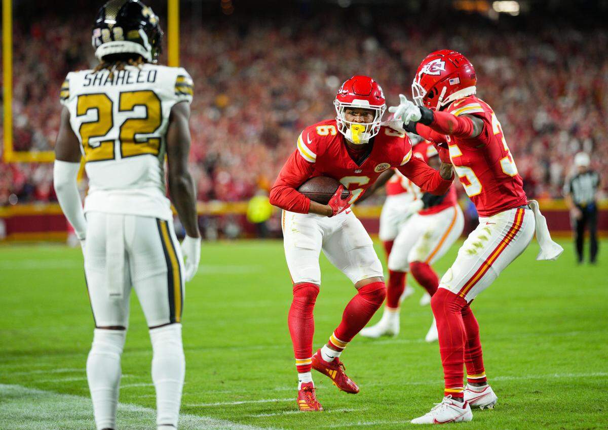 Kansas City Chiefs safety Bryan Cook (No. 6) celebrates his interception of New Orleans Saints quarterback Derek Carr with teammate Jaylen Watson (No. 35) during Monday night’s game at GEHA Field at Arrowhead Stadium.
